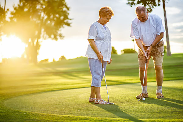 Senior Couple playing golf